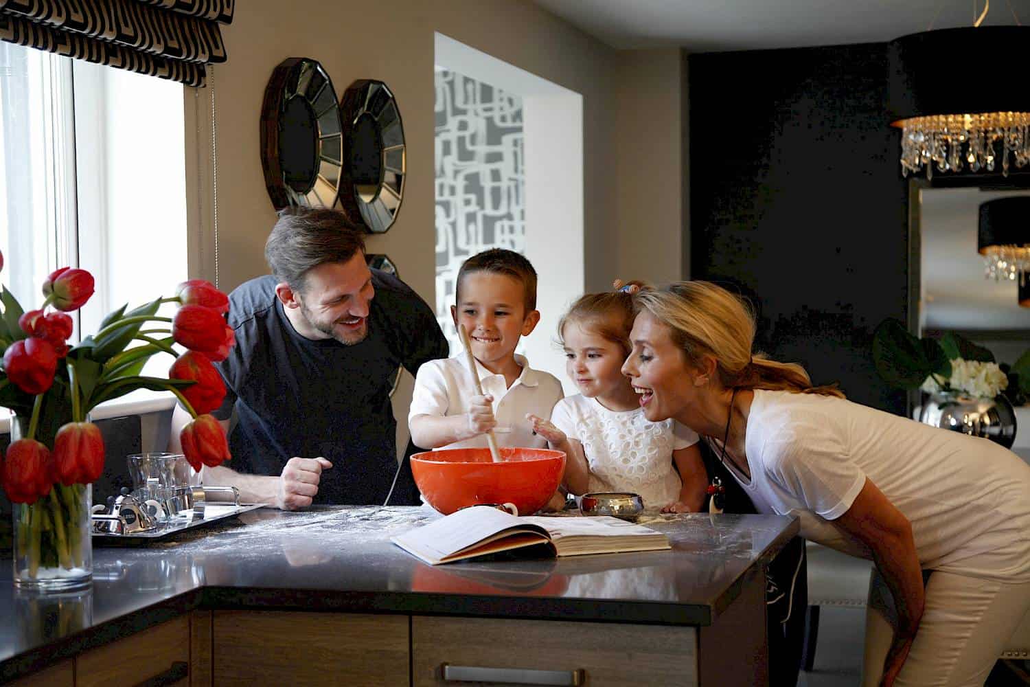 family cooking in kitchen