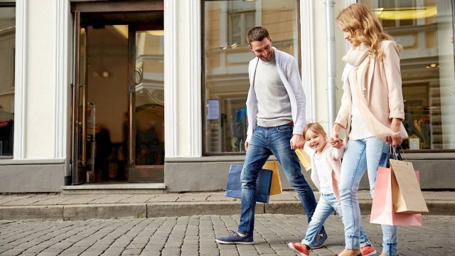 family walking down street