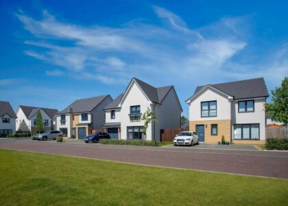 robertson homes streetscene with cars parked in drives